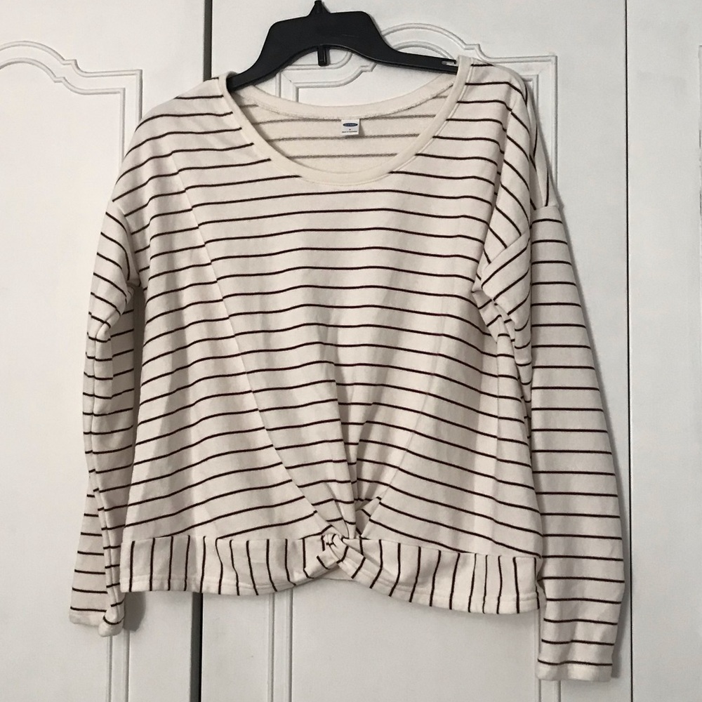 White and burgundy striped shirt.